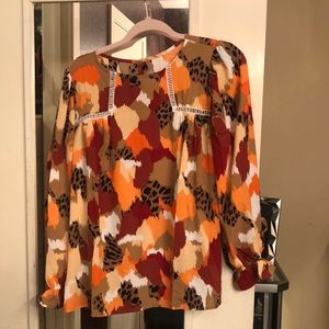Blouse colors are orange black burnt orange and taupe size med super cute